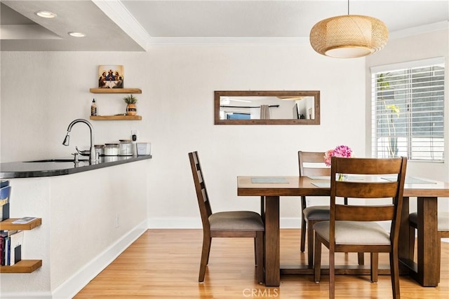 1100 Euclid Ave Unit 103, Long Beach, CA 90804 - dining space with crown molding, light wood finished floors, baseboards, and recessed lighting