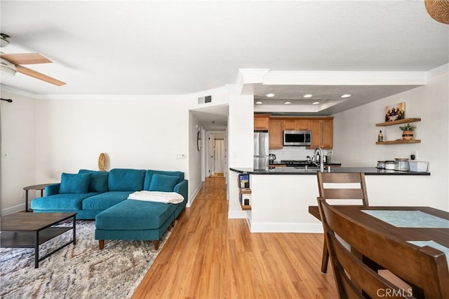 1100 Euclid Ave Unit 103, Long Beach, CA 90804 - living room featuring light wood-style flooring, ornamental molding, a ceiling fan, and baseboards