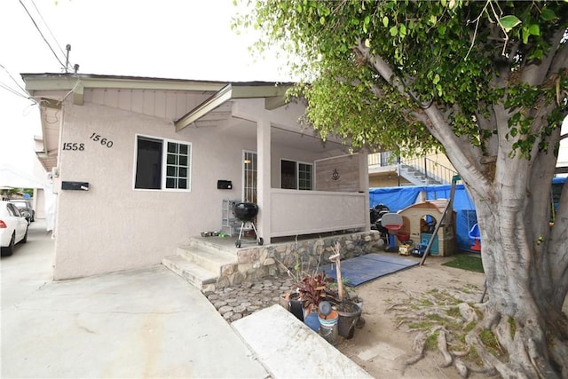 exterior space featuring stucco siding