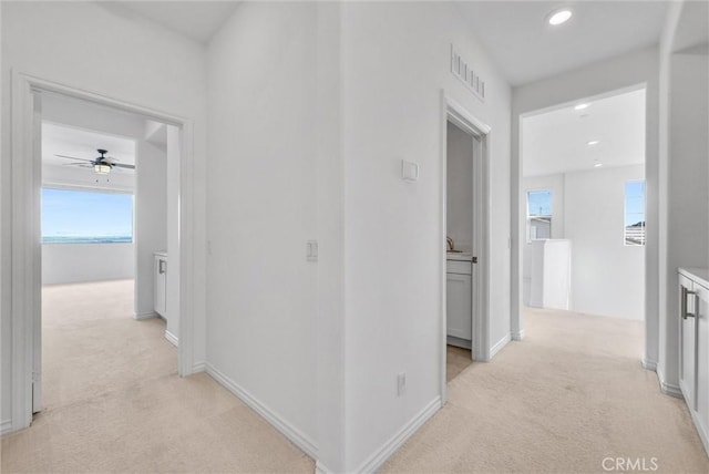 2575 Sierra Bella Dr, Corona, CA 92882 - hallway with visible vents, baseboards, recessed lighting, and light colored carpet