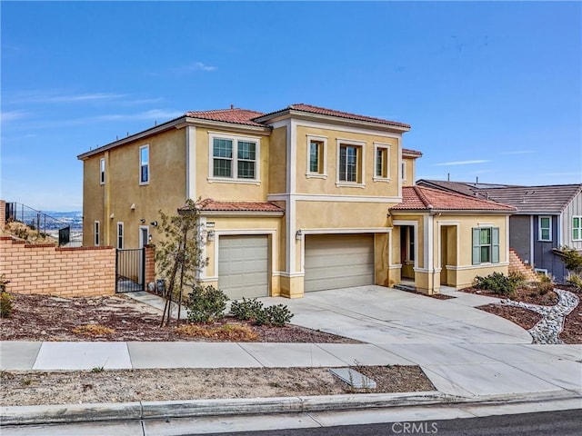 2575 Sierra Bella Dr, Corona, CA 92882 - view of front of property featuring a garage, stucco siding, fence, a tile roof, and driveway