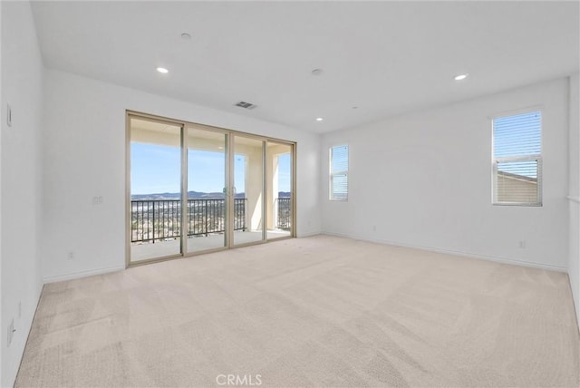 2575 Sierra Bella Dr, Corona, CA 92882 - spare room featuring visible vents, a wealth of natural light, and light colored carpet