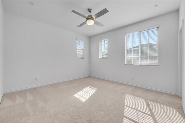 2575 Sierra Bella Dr, Corona, CA 92882 - spare room featuring light carpet, baseboards, and a ceiling fan