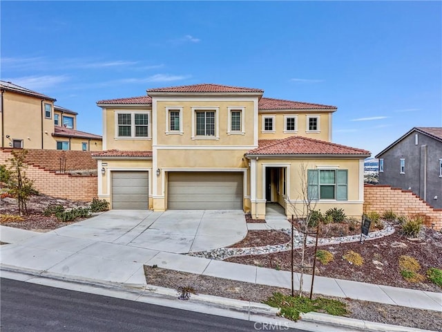 2575 Sierra Bella Dr, Corona, CA 92882 - mediterranean / spanish-style home with a tiled roof, an attached garage, concrete driveway, fence, and stucco siding