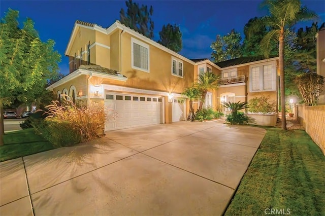 1731 Via Ln, Loma, Chino Hills, CA 91709 - mediterranean / spanish home featuring a garage, stucco siding, and driveway