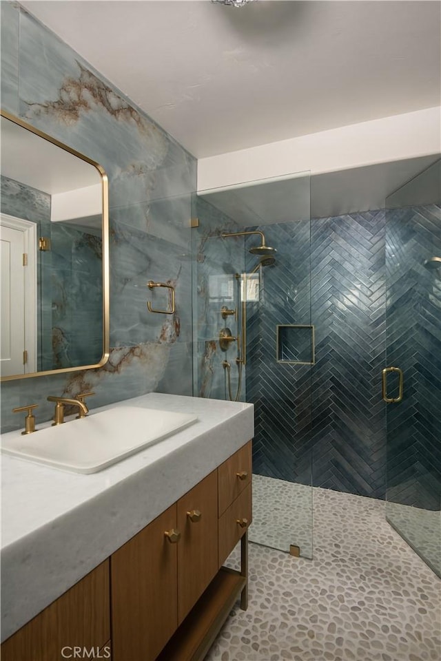 729 Brentwood Dr, Lake Arrowhead, CA 92352 - bathroom with a shower stall, vanity, and tile walls