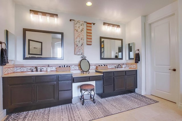 full bath with a sink and double vanity