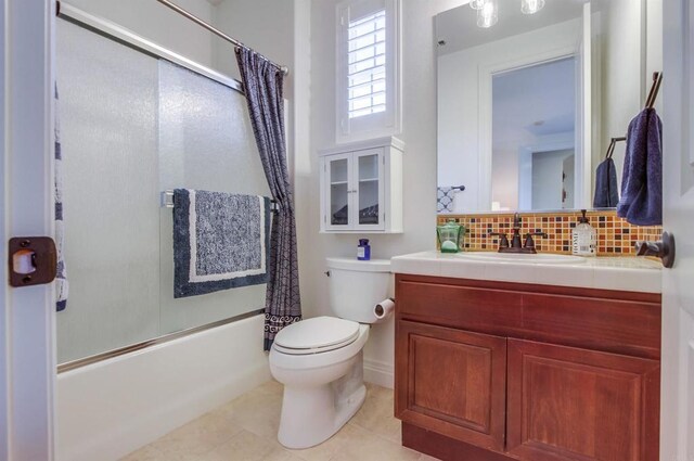 full bathroom featuring decorative backsplash, vanity, shower / tub combo with curtain, toilet, and tile patterned flooring
