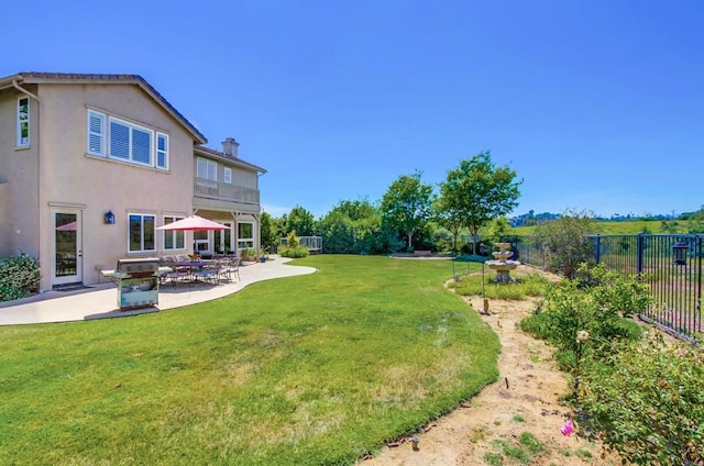view of yard featuring a patio and fence