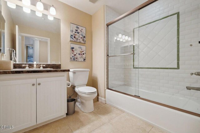 1551 Windshore Way, Oxnard, CA 93035 - bathroom with toilet, tile patterned floors, vanity, enclosed tub / shower combo, and baseboards