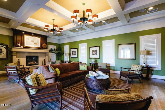 1551 Windshore Way, Oxnard, CA 93035 - living area with a chandelier, coffered ceiling, baseboards, wood finished floors, and a glass covered fireplace