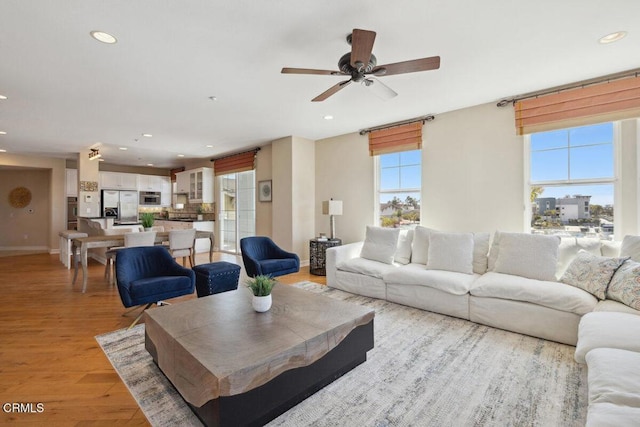 1551 Windshore Way, Oxnard, CA 93035 - living area featuring recessed lighting, baseboards, light wood-style flooring, and a ceiling fan