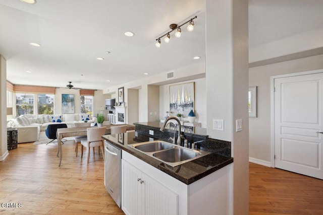 1551 Windshore Way, Oxnard, CA 93035 - kitchen featuring a sink, dishwasher, dark countertops, white cabinets, and recessed lighting