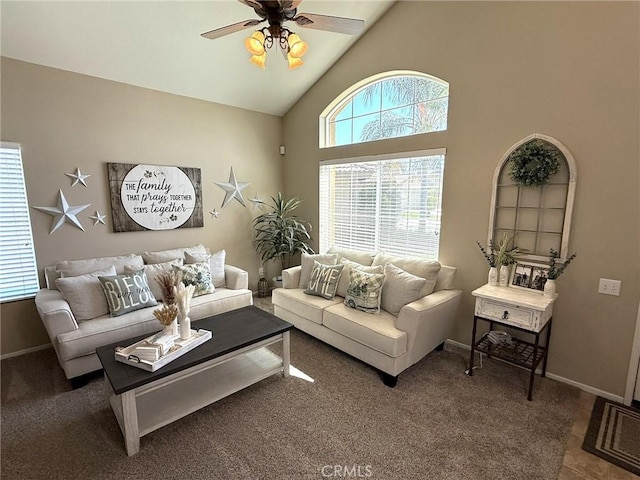 living room with ceiling fan, baseboards, high vaulted ceiling, and carpet flooring