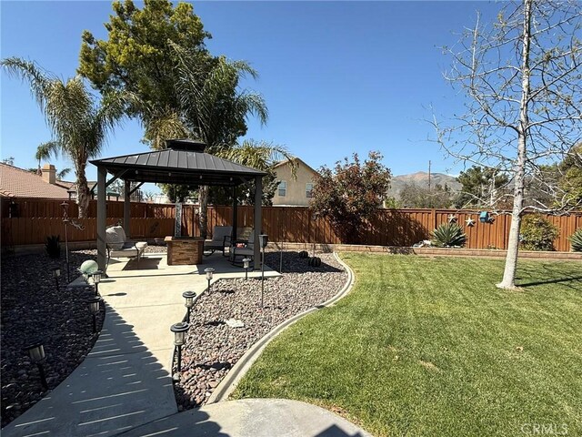 view of yard with a patio, a gazebo, and a fenced backyard
