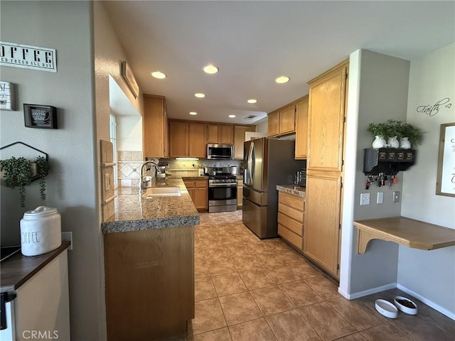kitchen with recessed lighting, a sink, light tile patterned floors, tasteful backsplash, and appliances with stainless steel finishes