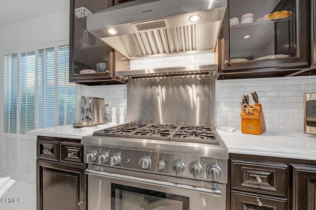 625 S Orange Grove Blvd Unit 3, Pasadena, CA 91105 - kitchen with glass insert cabinets, exhaust hood, stainless steel range, light countertops, and dark brown cabinets