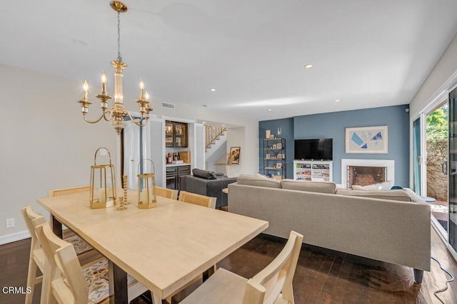 625 S Orange Grove Blvd Unit 3, Pasadena, CA 91105 - dining room with baseboards, a notable chandelier, recessed lighting, stairs, and dark wood-type flooring