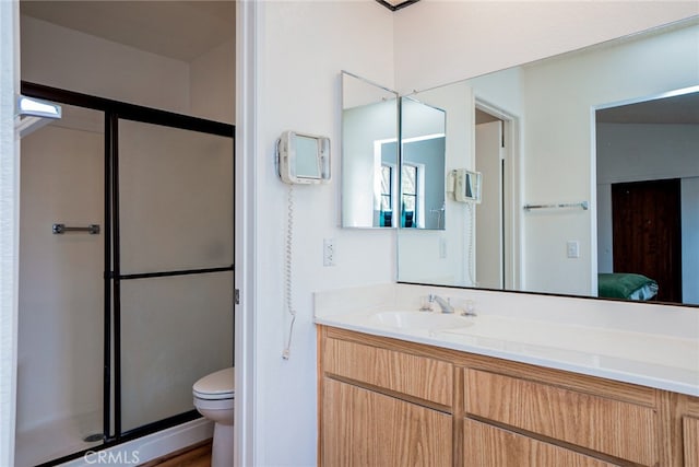 bathroom with toilet, vanity, connected bathroom, and an enclosed shower