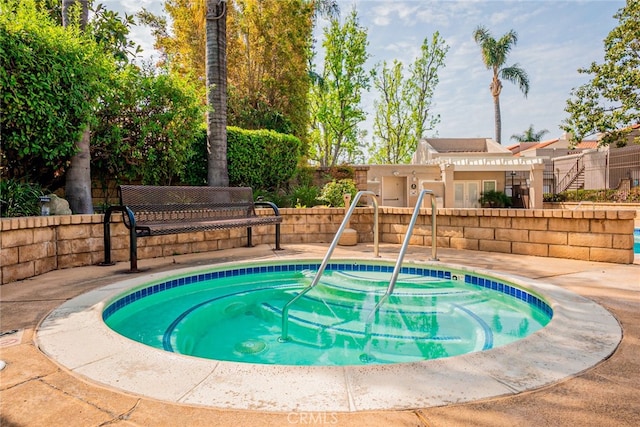 view of pool featuring fence and a patio