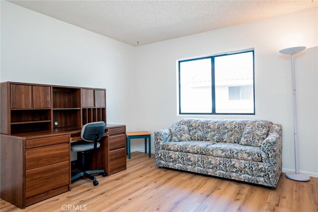 6923 Laguna Pl Unit C, Rancho Cucamonga, CA 91701 - office with light wood-type flooring, baseboards, and a textured ceiling