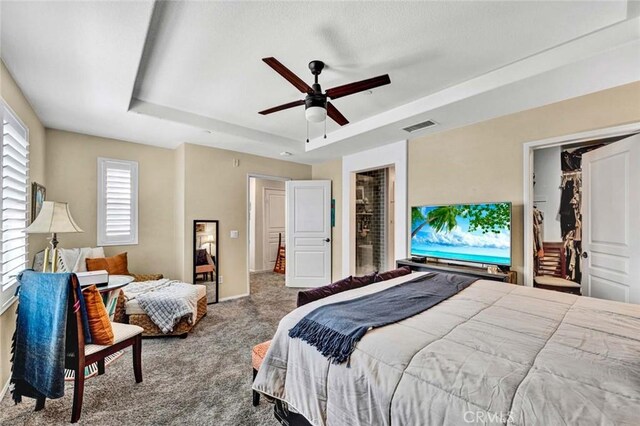 98 Hinterland Way, Ladera Ranch, CA 92694 - carpeted bedroom featuring visible vents, ceiling fan, a raised ceiling, and baseboards