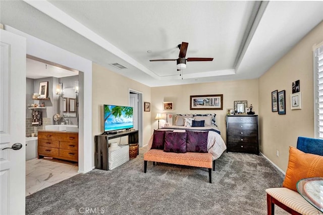 98 Hinterland Way, Ladera Ranch, CA 92694 - bedroom with visible vents, baseboards, a raised ceiling, ceiling fan, and ensuite bath