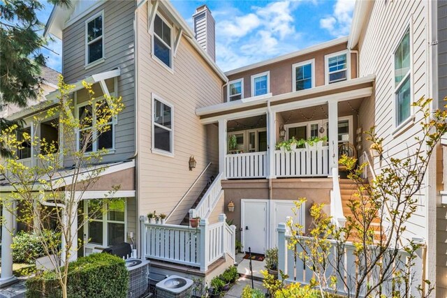 98 Hinterland Way, Ladera Ranch, CA 92694 - rear view of house featuring stairs, stucco siding, and cooling unit