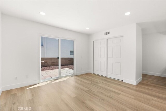 87 Tennessee St Unit C, Redlands, CA 92373 - unfurnished bedroom with baseboards, light wood-style flooring, a closet, and recessed lighting
