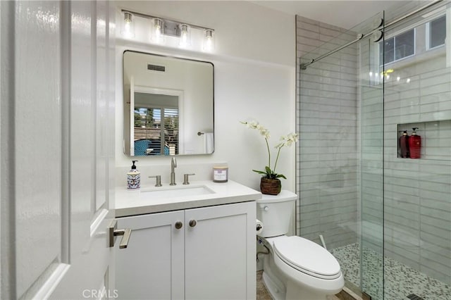 44 Edenbrook, Irvine, CA 92620 - bathroom with toilet, a stall shower, vanity, and visible vents