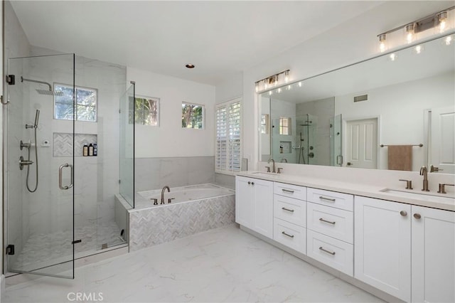 44 Edenbrook, Irvine, CA 92620 - full bathroom featuring a garden tub, marble finish floor, a sink, and a marble finish shower