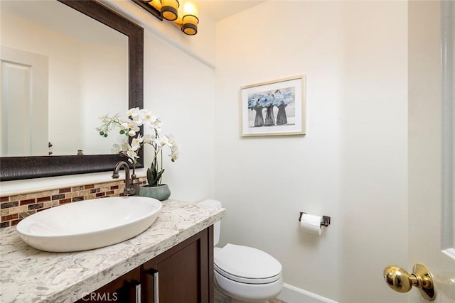 44 Edenbrook, Irvine, CA 92620 - bathroom featuring vanity, baseboards, backsplash, and toilet