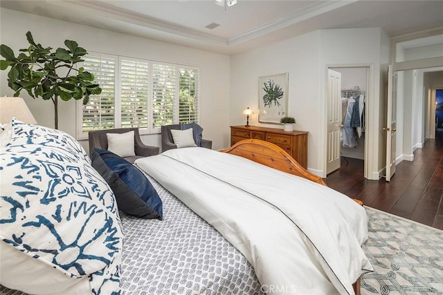 44 Edenbrook, Irvine, CA 92620 - bedroom with baseboards, ornamental molding, a closet, a spacious closet, and wood-type flooring