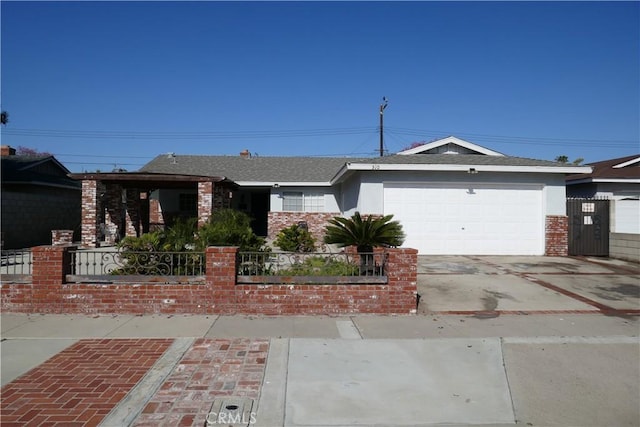 510 S King St, Santa Ana, CA 92704 - ranch-style home with a fenced front yard, an attached garage, concrete driveway, brick siding, and roof with shingles