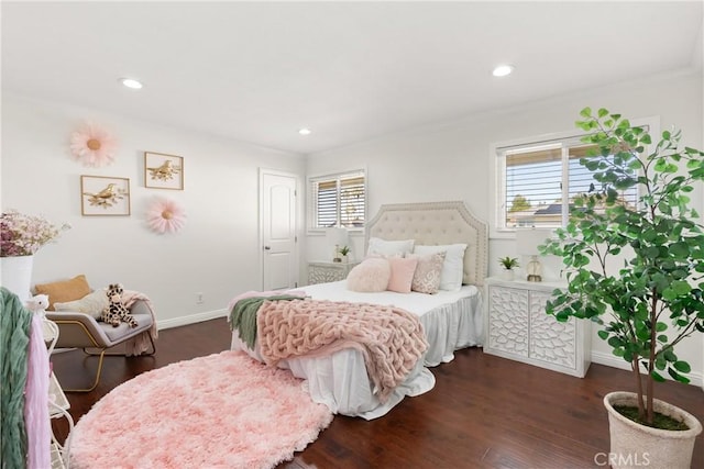 bedroom featuring ornamental molding, baseboards, and dark wood finished floors