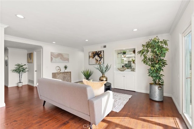 living room featuring crown molding, dark wood-style floors, visible vents, and recessed lighting