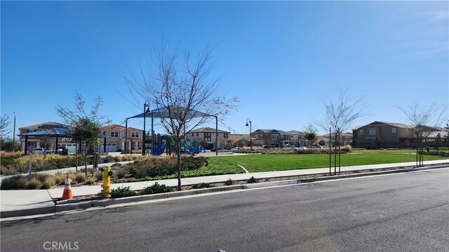 30874 Windy Ridge Way, Menifee, CA 92584 - view of front of house with a residential view and a front lawn