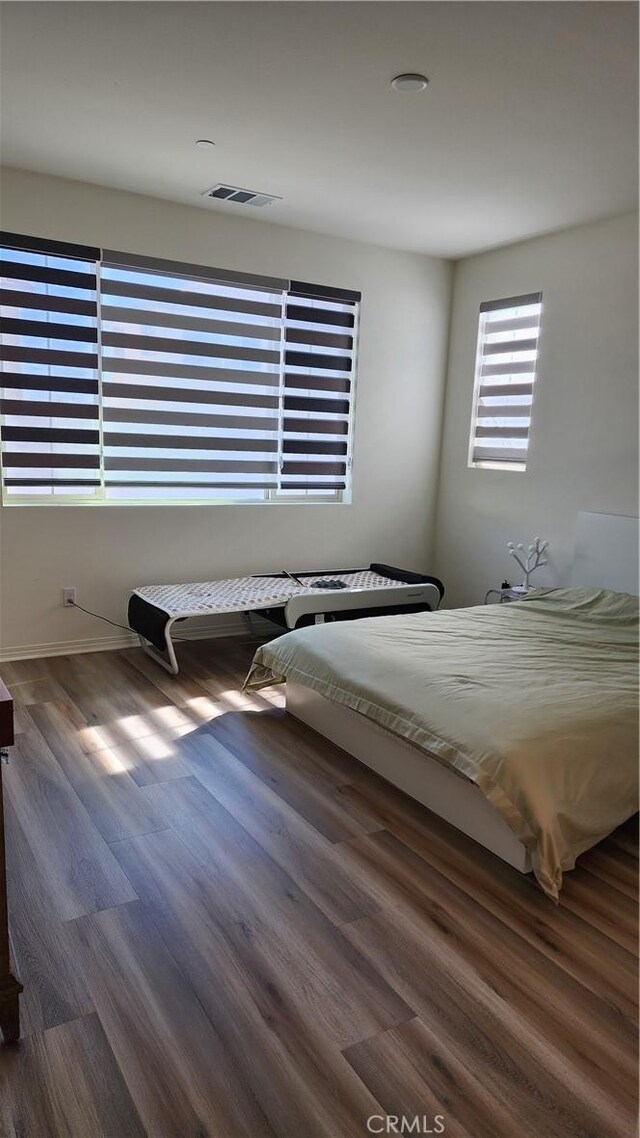 30874 Windy Ridge Way, Menifee, CA 92584 - bedroom with wood finished floors and baseboards