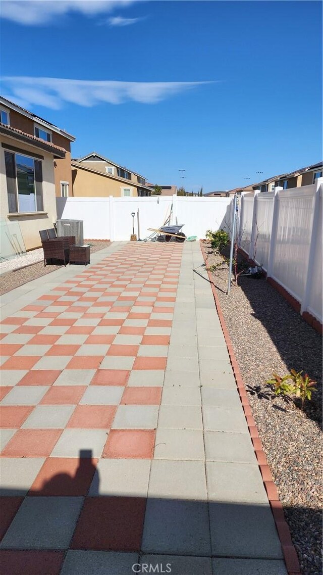 30874 Windy Ridge Way, Menifee, CA 92584 - fenced backyard with a patio area and cooling unit