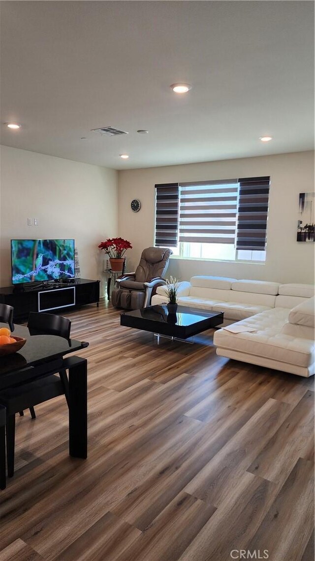 30874 Windy Ridge Way, Menifee, CA 92584 - living area featuring wood finished floors and recessed lighting