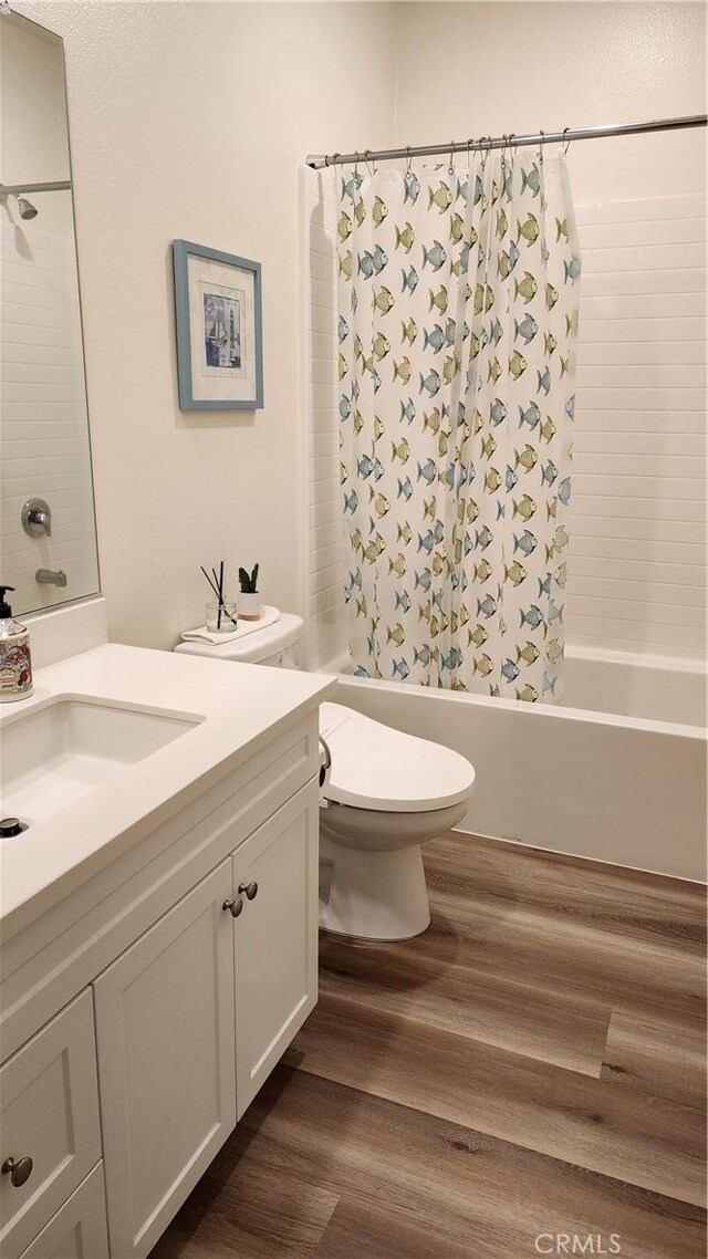 30874 Windy Ridge Way, Menifee, CA 92584 - bathroom with vanity, shower / bath combination with curtain, wood finished floors, and toilet