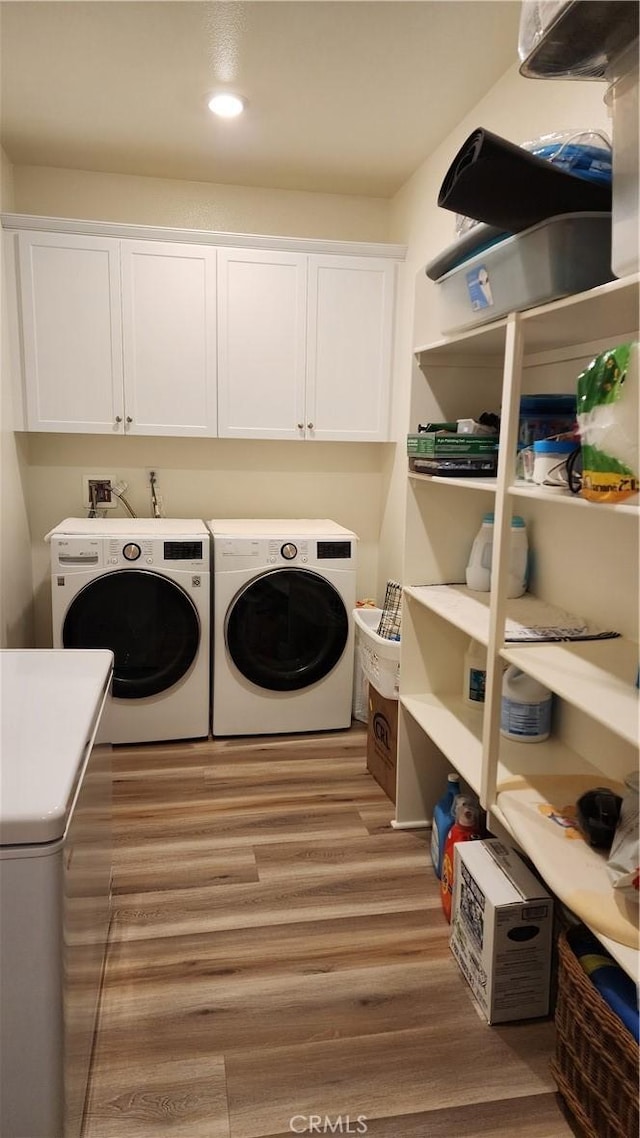 30874 Windy Ridge Way, Menifee, CA 92584 - laundry room featuring cabinet space, washer and clothes dryer, wood finished floors, and recessed lighting