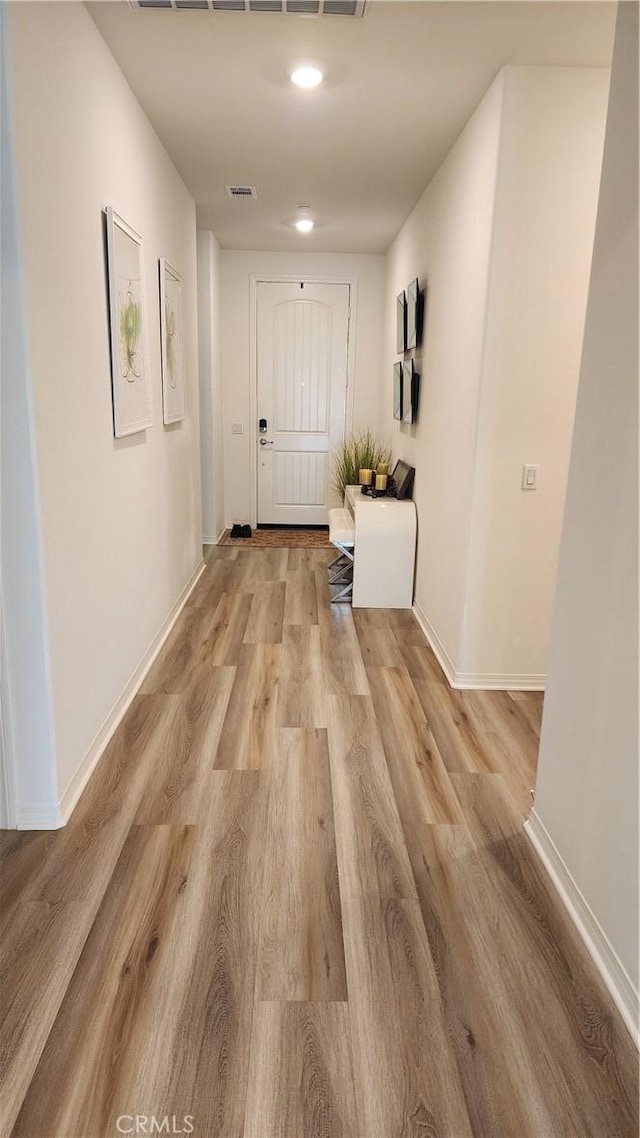 30874 Windy Ridge Way, Menifee, CA 92584 - corridor with light wood-style flooring and baseboards