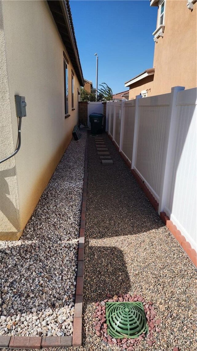 30874 Windy Ridge Way, Menifee, CA 92584 - view of side of property featuring stucco siding