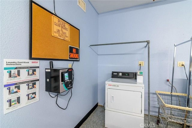 laundry room featuring visible vents, baseboards, and washer / dryer