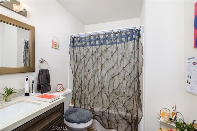 full bathroom with shower / bath combo, vanity, and toilet