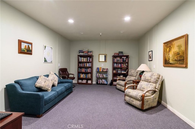 living room featuring carpet flooring, baseboards, and recessed lighting