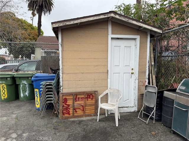 view of shed with fence