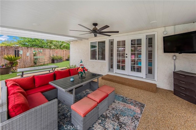view of patio featuring an outdoor hangout area, fence, ceiling fan, and french doors