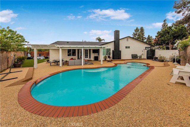 view of swimming pool with french doors, a fenced in pool, a fenced backyard, a patio, and a pergola